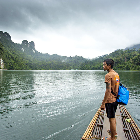 Student on a lake in Thailand on a service tour