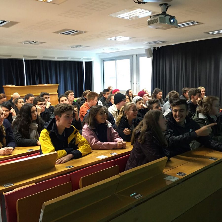 Students listening in lecture theatre