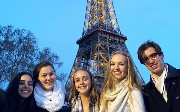 Educational tours to Europe - students in front of Eiffel Tower